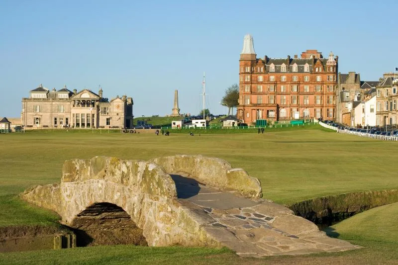 a stone bridge over a golf course