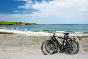 Two bikes near sandy beach on Inishmore, the largest of the Aran Islands in Galway Bay, Ireland. Ireland self guided tours