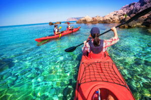 Kayaking. a woman floating on the sea kayak. Canoeing.