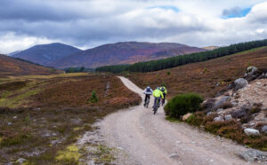 Narrow dirt road running through the Cairngorms National Park , Scotland, UK