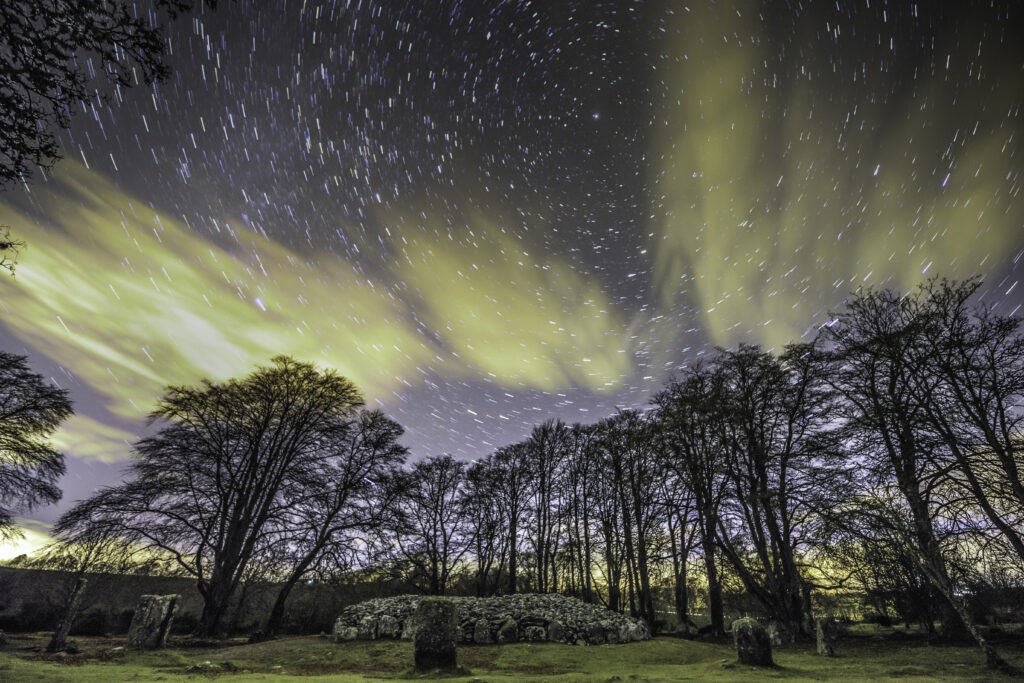 Star trail showing the movement of stars around polaris at Clava cairns an ancient burial site in Scotland