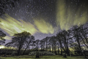 Star trail showing the movement of stars around polaris at Clava cairns an ancient burial site in Scotland