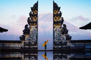 Female tourist at temple gates of heaven. Penataran Lempuyang Bali, Indonesia.