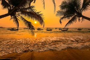 Ocean coast of Sri Lanka in the tropics, captured at sun set creating a orange colour in the sky